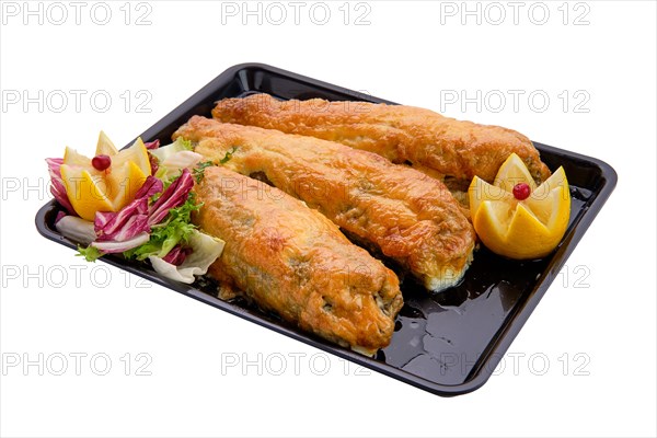 Baked fish in batter on tray isolated on white