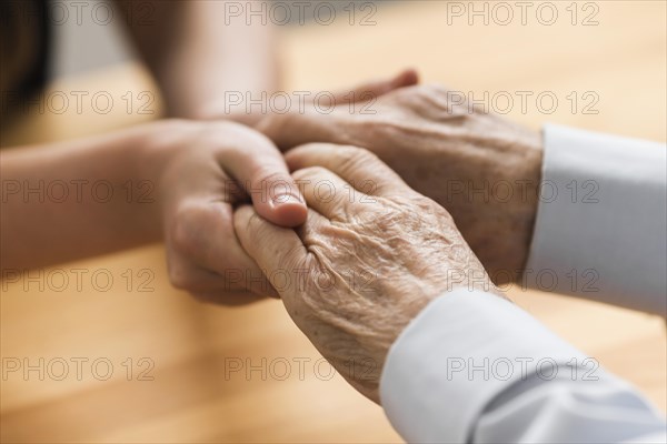 Nurse holding senior man s hands empathy. Resolution and high quality beautiful photo