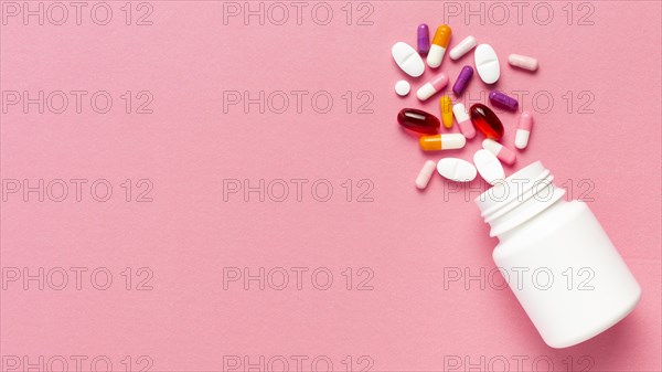 Pills bottle pink background