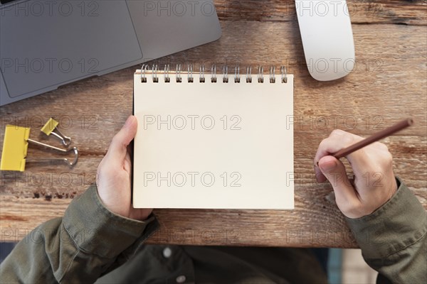 Top view freelancer taking notes. Resolution and high quality beautiful photo