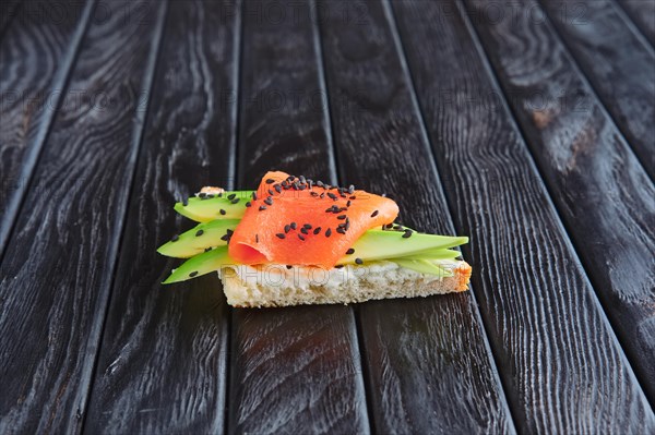 Appetizer for reception. Sandwich with smoked salmon