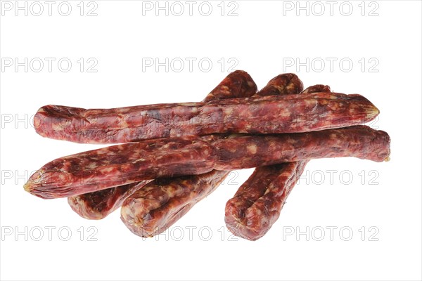 Dried jerked deer and pork sausage isolated on white background