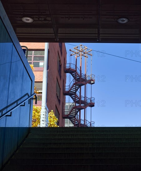 Staircase to brick building with spiral staircase