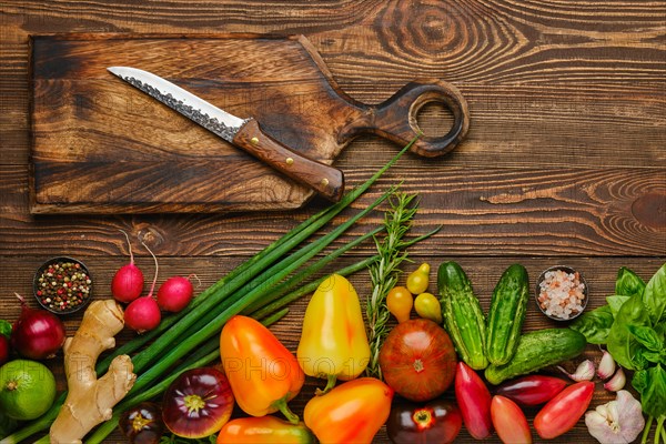 Top view of wooden table with different vegetables for salad. Healthy eating concept