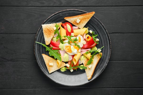 Overhead view of boiled eggs with slices of toast