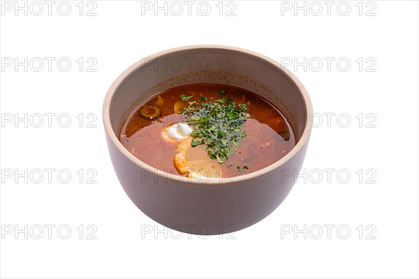 Traditional solyanka soup isolated on white