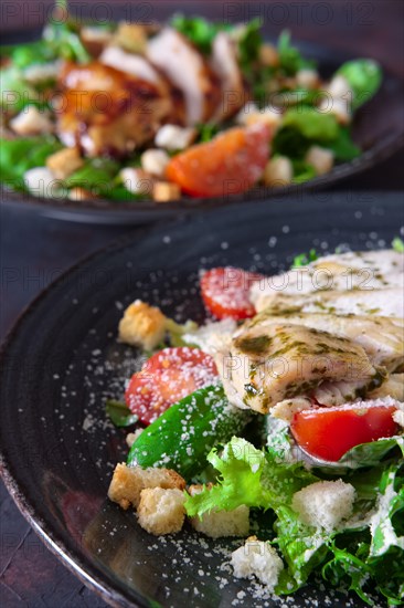 Salad with fried chicken and turkey fillet