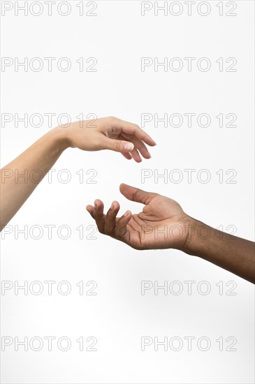 Multiracial hands coming together 2