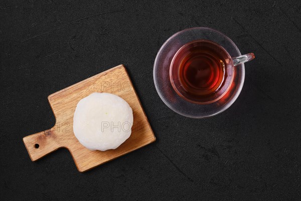 Top view of sweet dessert mochi with coconut chips with fruit tea