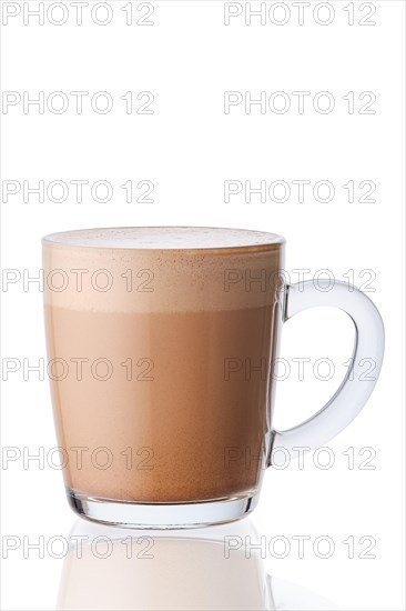 Cup of hot cocoa drink in transparent glass isolated on white background