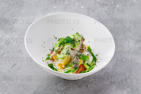 Portion of salad with herring