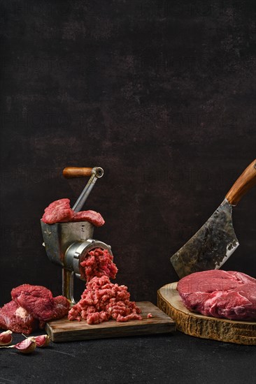 Making minced beef meat with oldfashioned meat grinder