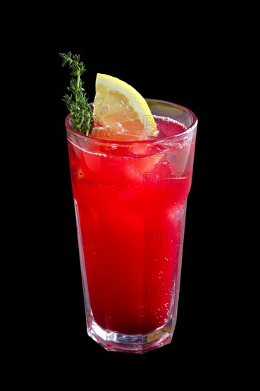 Glass of cranberry and lemon lemonade isolated on black