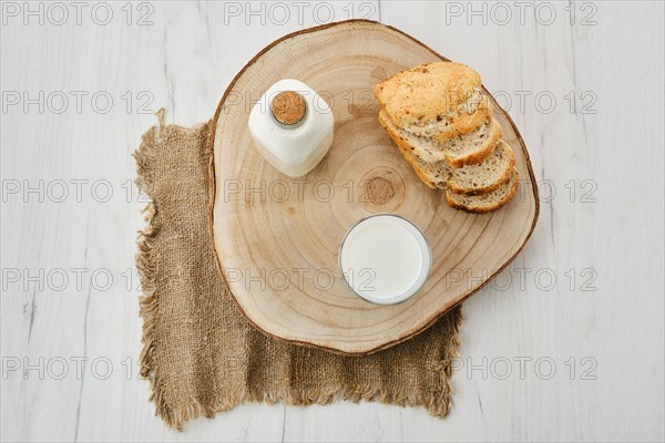 Top view of bottle and a glass of fresh milk