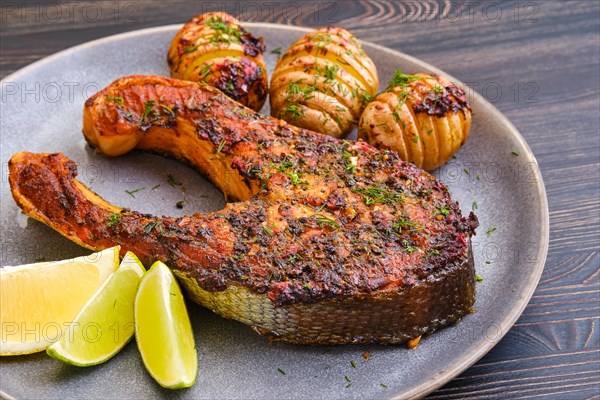 Baked salmon steak with hasselback potato