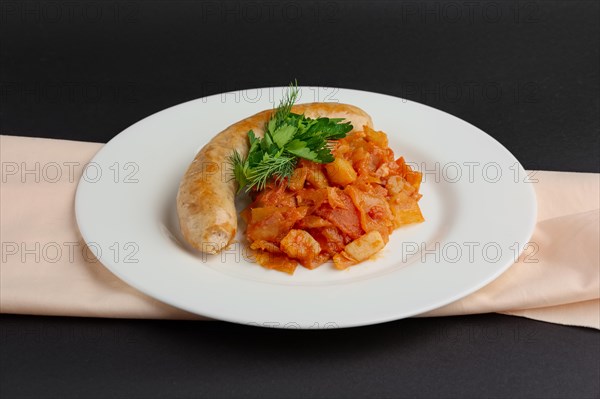 Homemade sausage with stewed cabbage