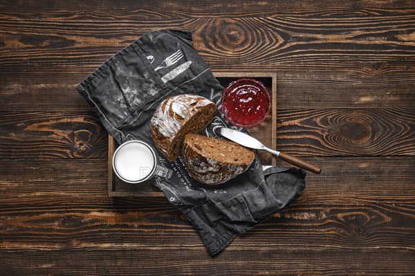 Fresh rye brown bread on wooden cutting board