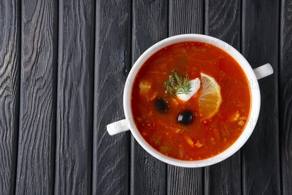 Top view of traditional rustic saltwort soup solyanka