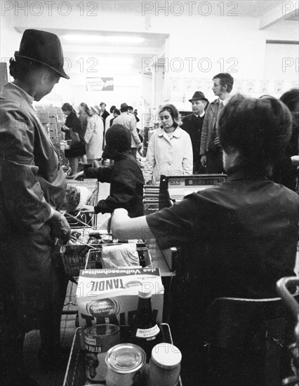 The work of a housewife and mother shopping for groceries at the supermarket and Aldi