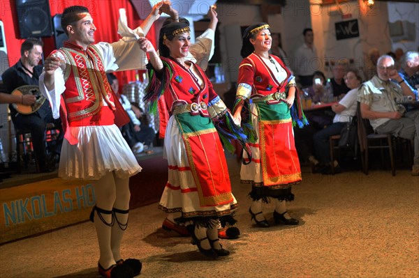 Tourists encounter impressive evidence of Roman and Greek history on a round trip through western Turkey and to the Greek island of Rhodes. The picture shows: Folk dance group in front of and with tourists on the island of Rhodes in Rhodes