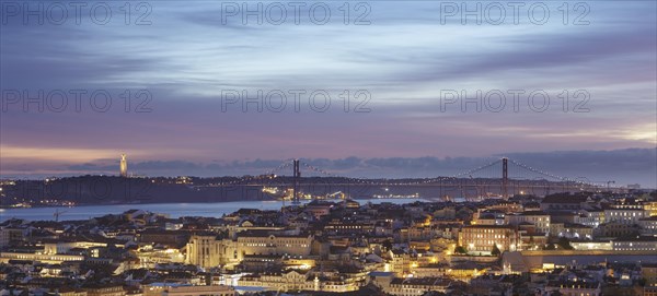 View over downtown with the Christ statue and the 25 de Abril bridge at night