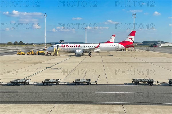 Aircraft Passenger aircraft Jets Jets of Austrian Airlines stand parked in parking position on flight apron of Vienna-Schwechat Vienna International Airport