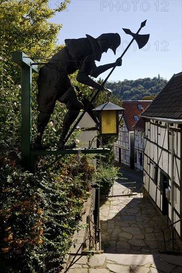 Half-timbered houses at the church steps with night watchman