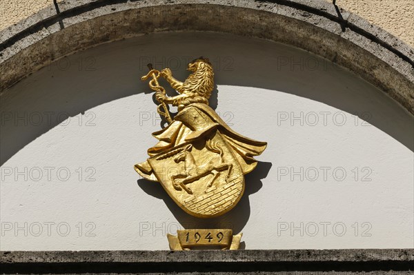 Golden lion with sceptre and coiling snake