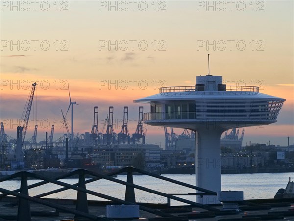 Lighthouse Zero on the Norderelbe in Hamburg's Hafencity against the backdrop of the container terminals and harbour cranes. Harbour