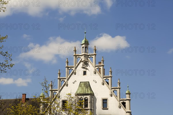 House with stone figure and turret