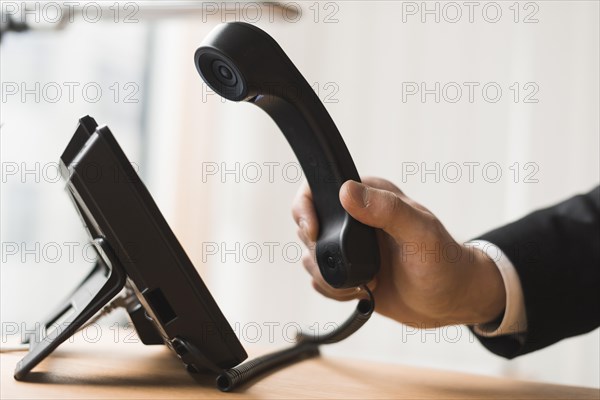 Businessman holding headset