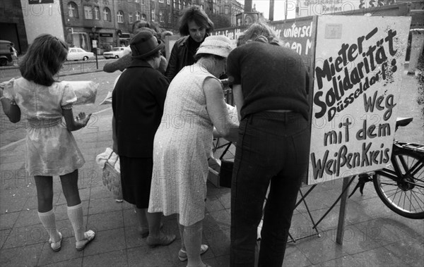 Tenants protest with a collection of signatures