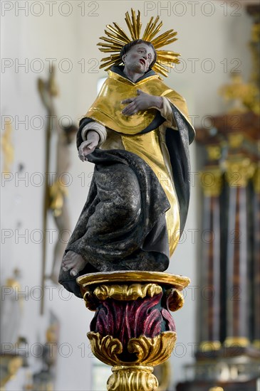 Figure of a saint with a wreath