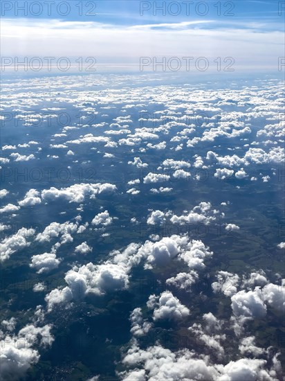 View from aeroplane of cluster clouds Altocumulus clouds Sheep clouds in the background Altostratus