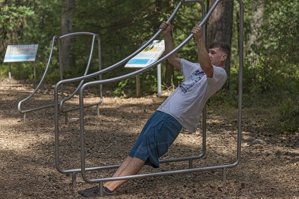 Young man on a fitness course