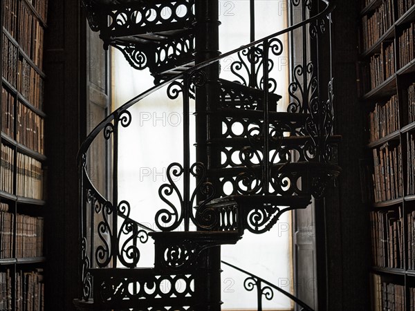 Spiral staircase and bookshelves