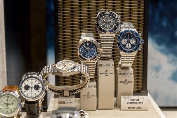 High quality watches of the luxury brand Breitling 1884 in the shop window with price tag