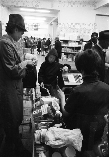 The work of a housewife and mother shopping for groceries at the supermarket and Aldi