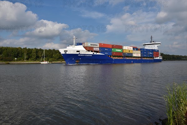 Container ship Heinrich Schepers sails through the Kiel Canal