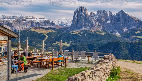 Sun terrace of the Rasciesa Hut on the Rasciesa Alp in front of the Sella Group 3152m