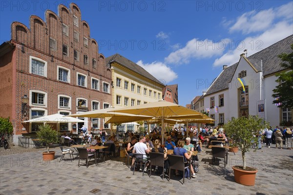 Historic merchants' houses and street cafe on the market square