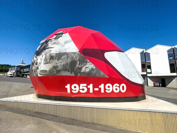 Open Air Museum Exhibition room with exhibition on racing history in the form of walk-in giant helmet with dates from decade 1951 to 1960 Fifties