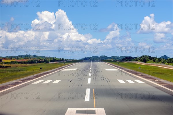 View from cockpit of aircraft on runway landing strip of Palau Koror Roman Tmetuchl International Airport ROR during takeoff