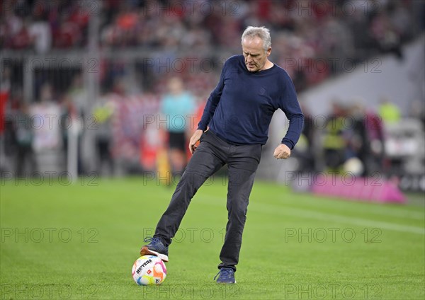 Coach Christian Streich SC Freiburg SCF retrieves ball from pitch