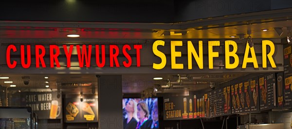 Neon sign on a sausage stand