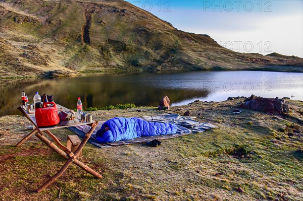 Outdoor overnight stay in a sleeping bag in the Peruvian highlands