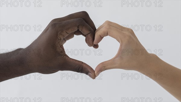 Black white hands making heart shape