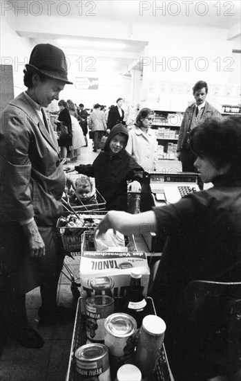 The work of a housewife and mother shopping for groceries at the supermarket and Aldi