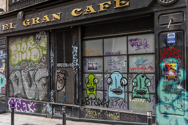 Graffiti on the blinds of vacant shops in the old town of Barcelona