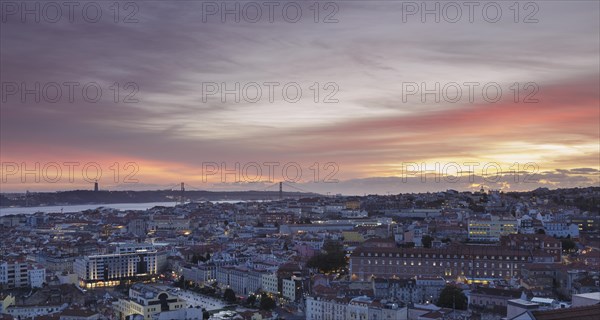 View over downtown with the Christ statue and the 25 de Abril bridge at night